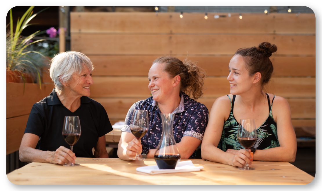 three women sitting at a table