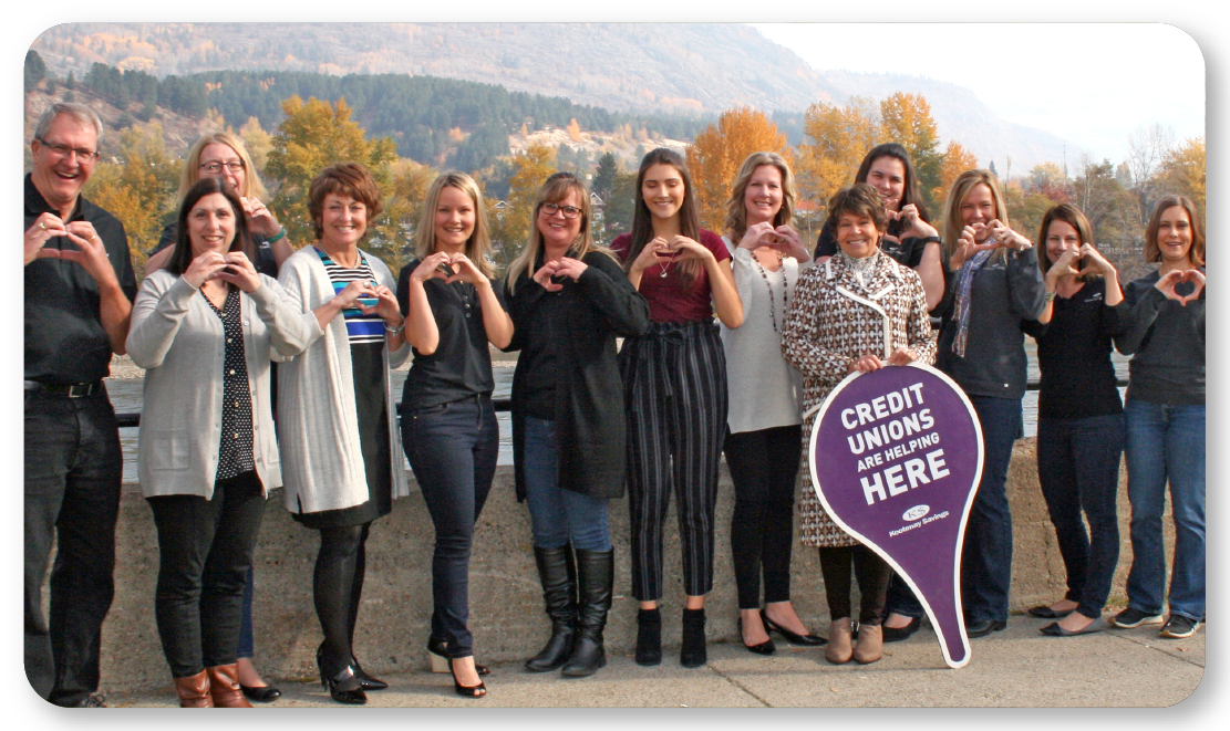 employees making heart shape