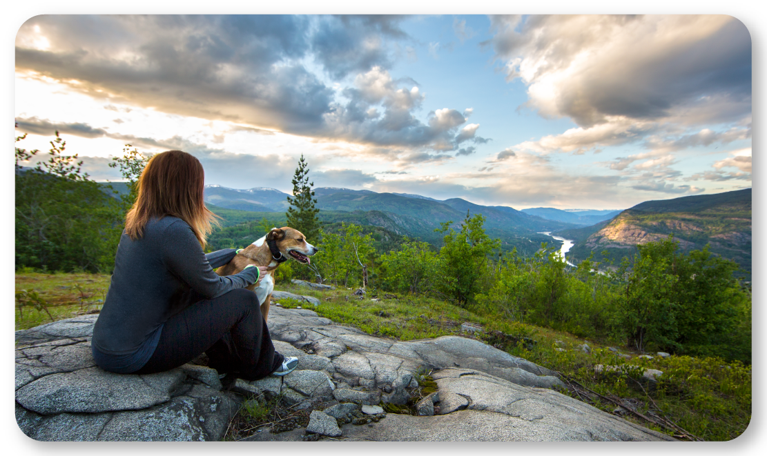 woman with beagle looking at view